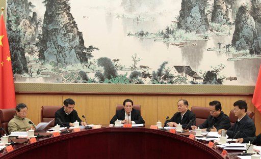 (111025) -- BEIJING Oct. 25 2011 (Xinhua) -- Zhou Yongkang (C) a member of the Standing Committee of the Political Bureau of the Communist Party of China (CPC) Central Committee presides over a meeting while being debriefed on the situation ...