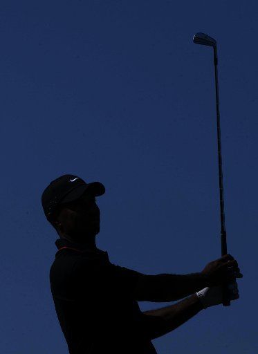 (121009) -- ANTALYA, Oct. 9, 2012 (Xinhua) -- Tiger Woods of the United States hits his tee shot on the ninth hole during his match against Charl Schwartzel of South Africa at the Turkish Airlines World Golf Final at Antalya Golf Club in Antalya, ...