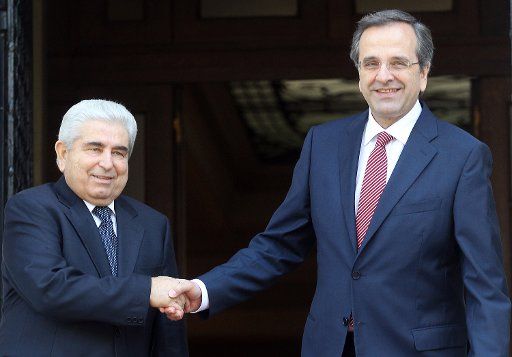 (121002) -- ATHENS, Oct. 2, 2012 (Xinhua) -- Greek Prime Minister Antonis Samaras (R) shakes hands with Cypriot President Dimitris Christofias (L) during their meeting at Maximou Mansion, in Athens, capital of Greece, on Oct. 2, 2012. (Xinhua\/Marios ...