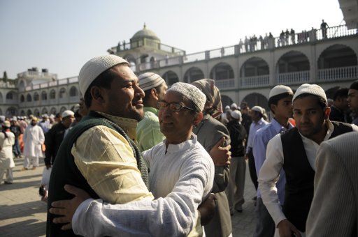 (121027) -- KATHMANDU, Oct. 27, 2012 (Xinhua) -- Nepalese Muslims greet each other after praying at Kashmiri Takiya Jame Mosque during the Muslim festival of Eid Al-Adha in Kathmandu, capital of Nepal, on Oct. 27, 2012. (Xinhua\/Sunil Pradhan) (lr)