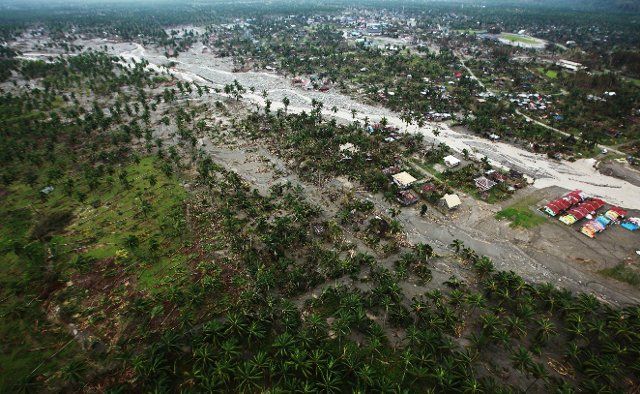 (121208) -- MANILA, Dec. 8, 2012 (Xinhua) -- Photo taken on Dec. 7, 2012 shows the typhoon-affected area in southern province of Compostela Valley, the Philippines. The death toll of Typhoon Bopha, locally known as Pablo, has climbed to 456 as more ...