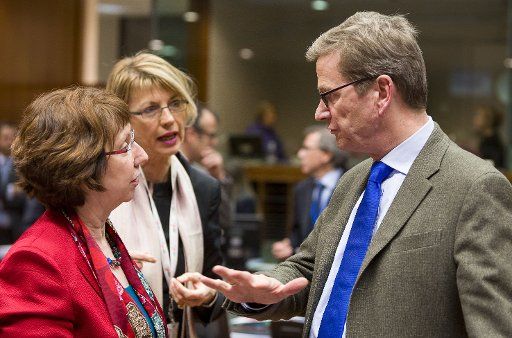 (121210) -- BRUSSELS, Dec. 10, 2012 (Xinhua) -- German Minister for Foreign Affairs Guido Westerwelle (R) talks with EU foreign policy chief Catherine Ashton at EU foreign ministers meeting at EU headquarters in Brussels, capital of Belgium, Dec. 10,...
