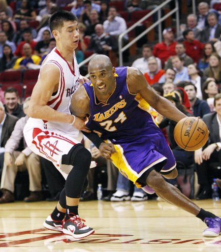 (130109) -- HOUSTON, Jan. 9, 2013 (Xinhua) -- Jeremy Lin (L) of Houston Rockets defends Kobe Bryant of Los Angeles Lakers during the NBA basketball game in Houston, the United States, on Jan. 8, 2013. Houston Rockets won the match 125-112. (Xinhua\/...