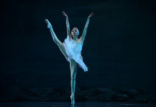 (130112) -- LANZHOU, Jan. 12, 2013 (Xinhua) -- A dancer of the Russian State Bullet performs "Swan Lake" at the Gansu Grand Theatre in Lanzhou, capital of northwest China\