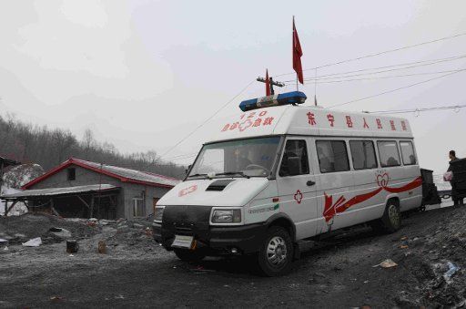 (130130) -- DONGNING, Jan. 30, 2013 (Xinhua) -- An ambulance is seen at the accident site of Yongsheng colliery where a coal mine accident happened, in Dongning County, northeast China\