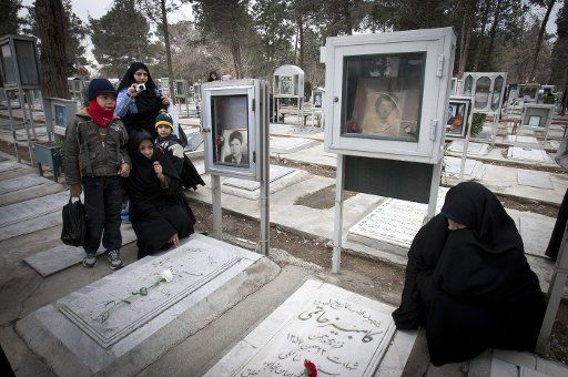 (130131) -- TEHRAN, Jan. 31, 2013 (Xinhua) -- Iranians visit the graves of people who were killed during the 1979 Islamic revolution at the Behesht-e Zahra cemetery outside Tehran, Iran, on Jan. 31, 2013, to mark the 34th anniversary of the Islamic ...