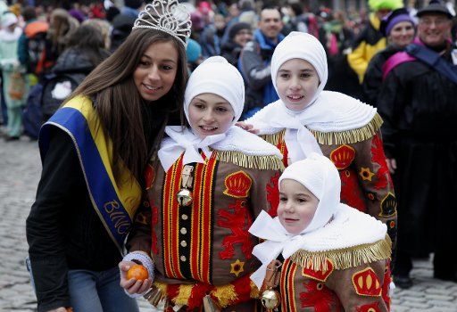 (130213) -- BINCHE, Feb. 13, 2013 (Xinhua) -- Miss Binche (1st L) poses with young Gilles during the Binche Carnival in Binche, Belgium, Feb. 12, 2013. Binche Carnival was inscribed on the Representative List of the Intangible Cultural Heritage of ...