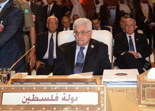 (130326) -- DOHA, March 26, 2013 (Xinhua) -- Palestinian President Mahmoud Abbas attends the 24th Arab League Summit in Doha, Qatar, on March 26, 2013. The two-day summit opened on Tuesday in Doha, with the Syrian crisis set to top its agenda. (...
