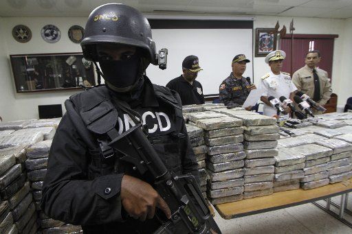 (130328) -- SANTO DOMINGO, March 28, 2013 (Xinhua) -- Members of Drug Control National Direction (DNCD, for its acronym in spanish) guard seized cocaine packages at the DNCD headquarters in Santo Domingo city, Dominican Republic, on March 27, 2013. ...