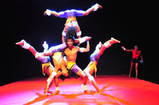(130421) -- BOMBAY, April 21, 2013 (Xinhua) -- Ators perform acrobatics at a theater in Bombay, India, April 20, 2013. The local circus group offered performances on the World Circus Day that falls on the third Saturday every April. (Xinhua\/Wang ...