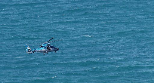 (130425) -- JERUSALEM, April 25, 2013 (Xinhua) -- An Israeli air force helicopter operates next to a cruise ship off the coast of Haifa, northern Israel, Thursday, April 25, 2013. An Israeli Air Force F-16 fighter jet downed a drone off the ...