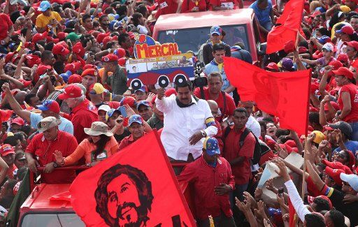 (130409) -- SUCRE, April 9, 2013 (Xinhua) -- Image provided by Hugo Chavez Campaign Command shows Venezuelan Acting President and presidential candidate Nicolas Maduro (C) attending a campaign in Sucre State, Venezuela, on April 8, 2013. Venezuela ...