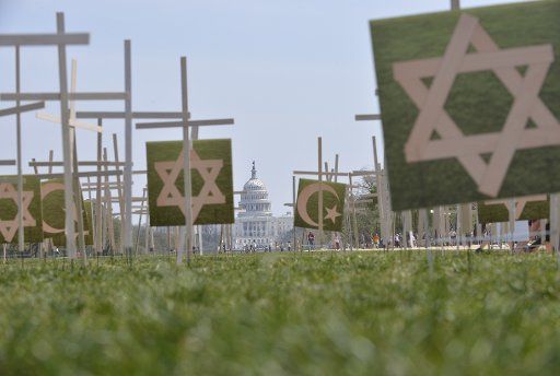 (130411) -- WASHINGTON D.C., April 11, 2013 (Xinhua) -- Grave markers are erected in a mock cemetery to honor the victims of gun violence during a 24-hour vigil on the National Mall in Washington D.C., capital of the United States, April 11, 2013. ...