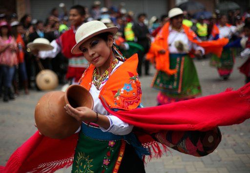 (130602) -- PUJILI, June 2, 2013 (Xinhua) -- A dancer wears a traditional costume during a parade in the framework of the Corpus Christi celebration, in Pujili, Ecuador, on June 1, 2013. (Xinhua\/Santiago Armas) (rt) (ce)