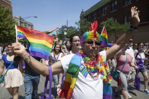 (130630) -- CHICAGO, June 30, 2013 (Xinhua) -- People participate in the annual Gay Pride Parade in Chicago, the United States, June 30, 2013. (Xinhua\/Jiang Xintong)