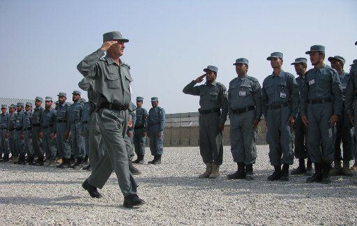 (131024) -- NANGARHAR, Oct. 24, 2013, (Xinhua) -- Afghan policemen march during their graduation ceremony in Nangarhar province, Afghanistan, on Oct. 24, 2013. A total of 107 newly policemen graduated after two months\