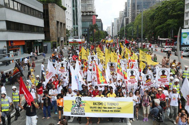 (131120) -- SAO PAULO, Nov. 20, 2013 (Xinhua) -- Demonstrators take part in a parade to mark the Day of Black Awareness in Sao Paulo, Brazil, Nov. 20, 2013. The Day of Black Awareness is celebrated annually on Nov. 20 in Brazil to reflect upon the ...