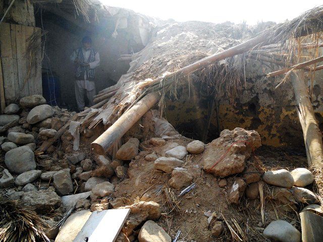 (131121) -- HANGU, Nov. 21, 2013 (Xinhua) -- A Pakistani journalist records the bombing site at a destroyed religious seminary after US drone strike in northwest Pakistan\