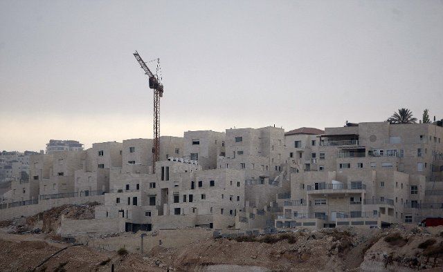 (131126) -- JERUSALEM, Nov. 26, 2013 (Xinhua) -- A construction site is seen in Pisgat Zeev, an urban settlement in an area Israel annexed to Jerusalem after the 1967 Middle East war, near the Arab village of Beit Hanina, North Jerusalem, on Nov. 25,...