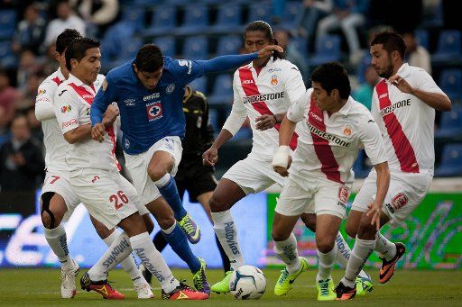 (131103) -- MEXICO CITY, Nov. 3, 2013 (Xinhua) -- Joao Rojas (3rd,L) of Cruz Azul vies for the ball with Christian de Jesus Valdez (2nd,L)of Morelia during a match of the Liga MX in the Azul Stadium, in Mexico City, capital of Mexico, on Nov. 2, ...