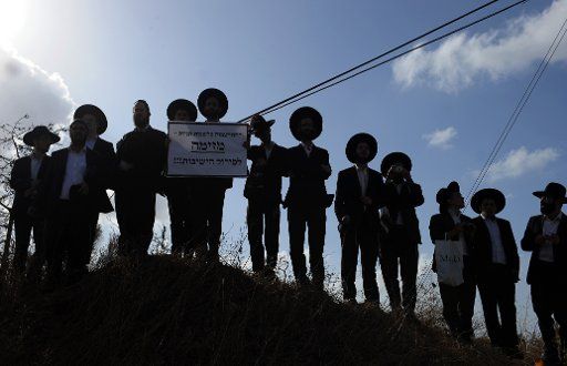 (131205) -- JERUSALEM, Dec. 05, 2013 (Xinhua) -- Ultra-Orthodox Jewish yeshiva students demonstrate outside Prison 6 near Haifa, northern Israel, on Dec. 4, 2013. Hundreds of ultra-Orthodox Jewish yeshiva students demonstrated here Wednesday in ...