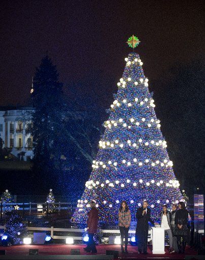 (131207) -- WASHINGTON D.C., Dec. 7, 2013 (Xinhua) -- U.S. President Barack Obama (3rd L) lights the 91st National Christmas Tree during a ceremony on the Ellipse south of the White House in Washington D.C., capital of the United States, Dec. 6, ...