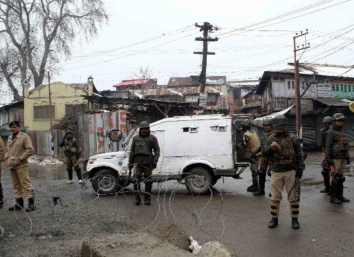 (140315) -- SRINAGAR, March 15, 2014 (Xinhua) -- Indian paramilitary troopers stand guard during restrictions in the old town of the Srinagar city, summer capital of Indian-controlled Kashmir, March 15, 2014. Restrictions were clamped in the old ...