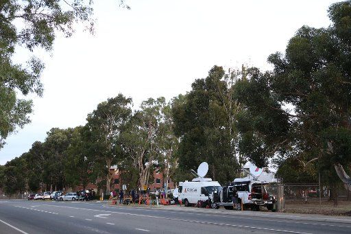 (140320) -- PERTH, March 20, 2014 (Xinhua) -- Journalists wait outside the Royal Australian Air Force (RAAF) Base Pearce, near Perth, Australia, March 20, 2014. The Australian government announced earlier Thursday that they had spotted on satellite ...