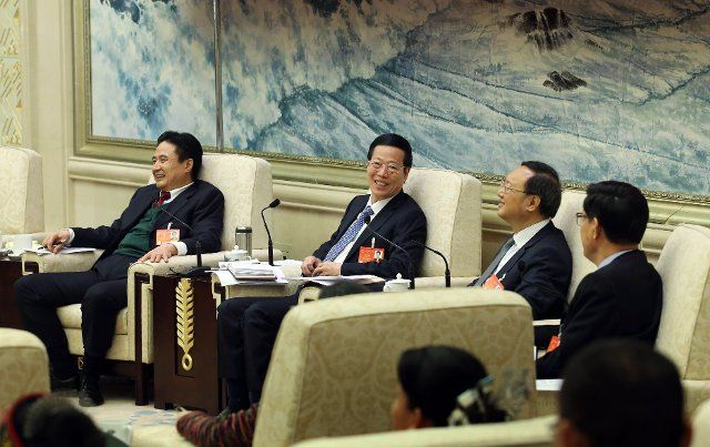 (140309) -- BEIJING, March 9, 2014 (Xinhua) -- Chinese Vice Premier Zhang Gaoli (2nd L), also a member of the Standing Committee of the Political Bureau of the Communist Party of China Central Committee, joins a discussion with deputies to China\