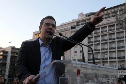 (140330) -- ATHENS, March 30, 2014 (Xinhua) -- Opposition leader Alexis Tsipras of the Radical Left SYRIZA party speaks to demonstrators during a protest against a new austerity bill that is being discussed in the Parliament, in Athens on Sunday, ...
