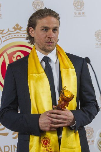 (140602) -- LOS ANGELES, June 2, 2014 (Xinhua) -- Actor Charlie Hunnam poses in the press room with the Best Global Emerging Actor Award during the Huading Film Awards at the Ricardo Montalban Theater on Sunday, June 1, 2014, in Hollywood, ...
