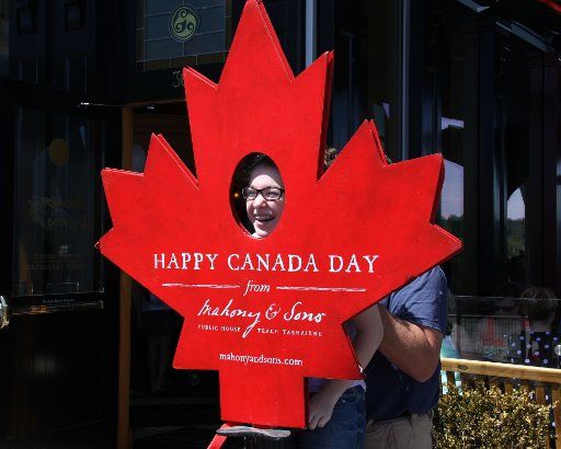 (140702) -- VANCOUVER, July 2, 2014 (Xinhua) -- People take photos for fun to celebrate Canada Day in downtown Vancouver, Canada, on July 1, 2014. Celebrations were held across the country to mark the 147th anniversary of Canada\