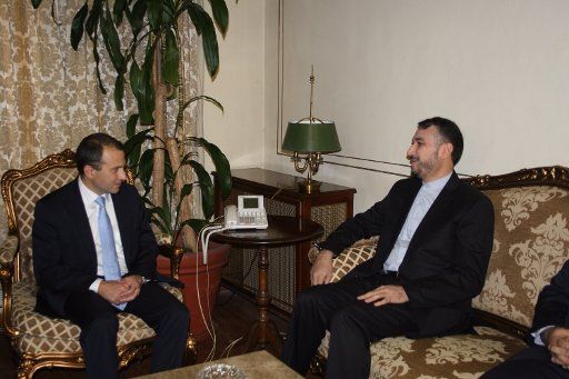 (140726) -- BEIRUT, July 26, 2014 (Xinhua) -- Lebanese Foreign Minister Gebran Bassil (L) meets with Iranian Deputy Foreign Minister for Arab and African Affairs Hossein Amir-Abdollahian in Beirut, Lebanon, on July 26, 2014. Abdollahian said that ...
