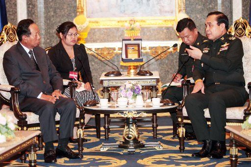 (140729) -- BANGKOK, July 29, 2014 (Xinhua) -- Thai Army Chief Gen. Prayuth Chan-ocha (R, front) meets with visiting Cambodian Deputy Prime Minister and Defense Minister Tea Banh (L, front) at Royal Thai Army headquarters in Bangkok, Thailand, July ...