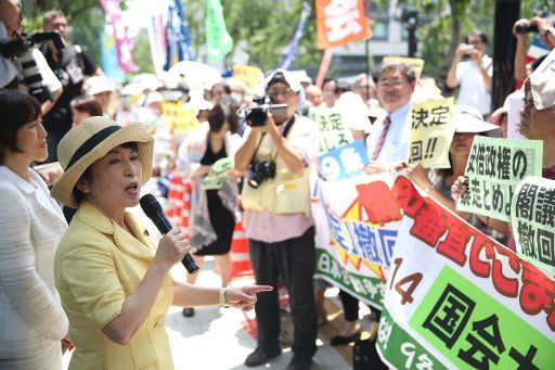 (140714) -- TOKYO, July 14, 2014 (Xinhua) -- Mizuho Fukushima, former leader of a Japanese opposition party the Social Democratic Party, speaks during a protest against Japan\