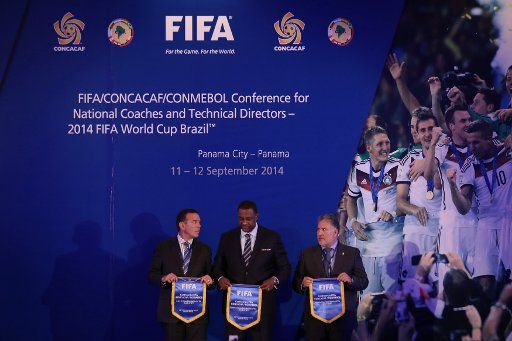 (140912) -- PANAMA CITY, Sept. 12, 2014 (Xinhua) -- President of the South American Football Confederation, Juan Angel Napout (L), the President of the football Confederation of North America, Central America and Caribbean Jeffrey Webb (C), and ...