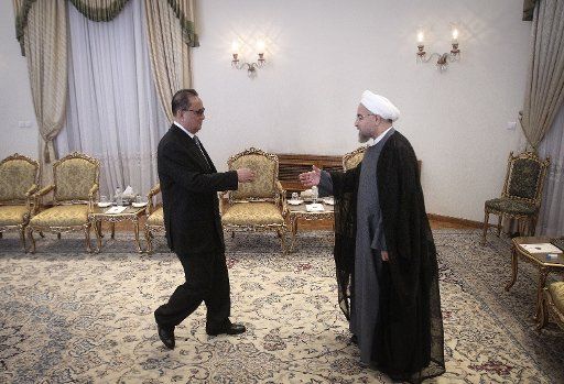 (140916) -- TEHRAN, Sept. 16, 2014 (Xinhua) -- Iranian President Hassan Rouhani (R) meets with Ri Su Yong, Foreign Minister of the Democratic People\