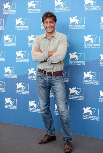 (140830) -- VENICE, Aug. 30, 2014 (Xinhua) -- Actor Adriano Giannini poses during the photo call for "Senza Nessuna Pieta" during the 71st Venice Film Festival in Lido of Venice, Italy, Aug. 30, 2014. (Xinhua\/Liu Lihang)