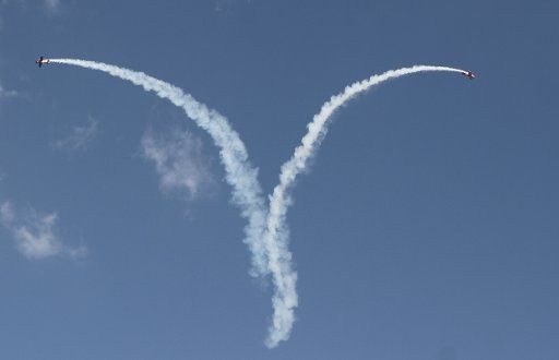 (140907) -- HARARE, Sept. 7, 2014 (Xinhua) -- Two jets perform stunts during the Big African Show held at Prince Charles Airport on the outskirts of Harare, Zimbabwe, Sept. 7, 2014. Thousands of people paid to watch pilots from the Southern Africa ...