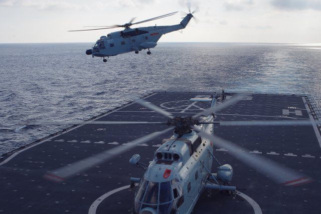 (141005) -- CHANGBAISHAN WARSHIP, Oct. 5, 2014 (Xinhua) -- A helicopter takes off from Changbaishan warship, during an escort mission in the Gulf of Aden, on Oct. 4, 2014. Changbaishan warship is part of the 18th batch of convoy fleet sent by the ...