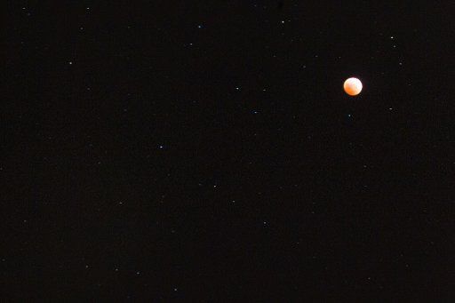 (141008) -- HONOLULU, Oct. 8, 2014 (Xinhua) -- Blood moon is seen in the sky during a total lunar eclipse in Honolulu, Hawaii, the United States, on Oct. 8, 2014. A total lunar eclipse is sometimes called a blood moon because of the red color that ...
