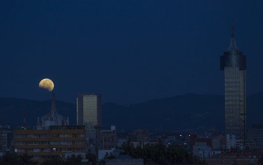 (141008) -- MEXICO CITY, Oct. 08, 2014 (Xinhua) -- The moon is seen in the sky during the total lunar eclipse, in Mexico City, capital of Mexico, on Oct. 8, 2014. A total lunar eclipse is sometimes called a blood moon because of the red color that ...