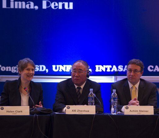 (141208)---LIMA, Dec. 8, 2014 (Xinhua) -- Xie Zhenhua (C), deputy chief of the National Development and Reform Commission (NDRC), who co-heads the Chinese delegation in Lima, attends the South-South Cooperation on Climate Change Forum held in Lima, ...