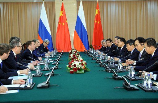 (141215) -- ASTANA, Dec. 15, 2014 (Xinhua) -- Chinese Premier Li Keqiang (4th R) meets with Russian Prime Minister Dmitry Medvedev (4th L) in Astana, Kazakhstan, Dec. 15, 2014. (Xinhua\/Rao Aimin) (ry)