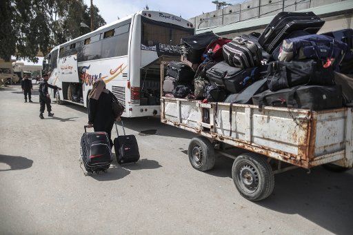 (150309) -- GAZA, March 9, 2015 (Xinhua) -- A Palestinian woman, hoping to cross into Egypt, drags her luggages at the Rafah crossing point between Egypt and the southern Gaza Strip, March 9, 2015. Egypt on Monday reopened Rafah crossing point on ...