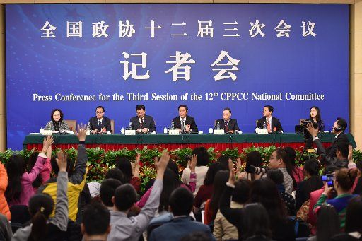 (150311) -- BEIJING, March 11, 2015 (Xinhua) -- Zhu Weiqun(C), Huang Jiefu(3rd R), Hu Xiaoyi(3rd L), Li Yanhong(2nd R), Yu Minhong(2nd L), members of the 12th National Committee of the Chinese People\