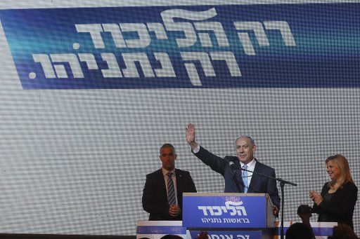 (150318) -- JERUSALEM, March 18, 2015 (Xinhua) -- Israeli Prime Minister and Likud Party leader Benjamin Netanyahu (2nd R) waves to supporters with his wife Sara (1st R) at Likud Party campaign headquarters in Tel Aviv, Israel, on March 18, 2015. ...