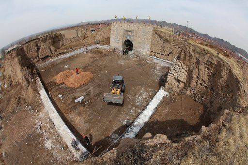 (150407) -- WANQUAN, April 7, 2015 (Xinhua) -- Workers restore the southern barbican entrance to Wanquan Castle in Wanquan County, north China\
