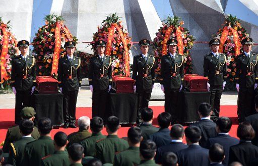 (150321) -- SHENYANG, March 21, 2015 (Xinhua) -- Soldiers escort coffins of 68 Chinese soldiers killed in the 1950-53 Korean War in a martyrs\