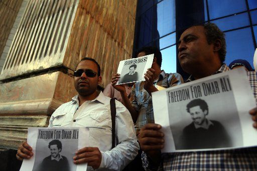 (150503) -- CAIRO, May 3, 2015 (Xinhua) -- Egyptian journalists and family members of imprisoned journalists protest in front of the Journalist Syndicate demanding for the release of journalists imprisoned since June 30, 2013, in Cairo, Egypt, on ...